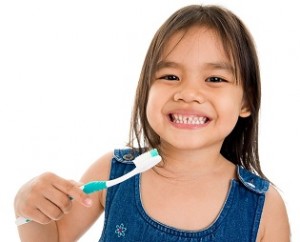 Young Girl Brushing Teeth