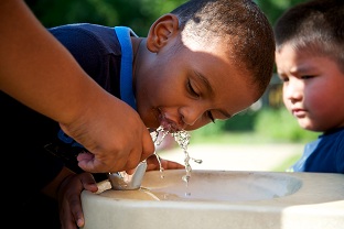 Boy Using Water Fountain