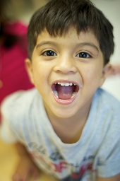 Boy Smiling with Teeth