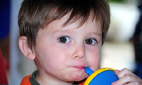 Boy Drinking from Sippy Cup